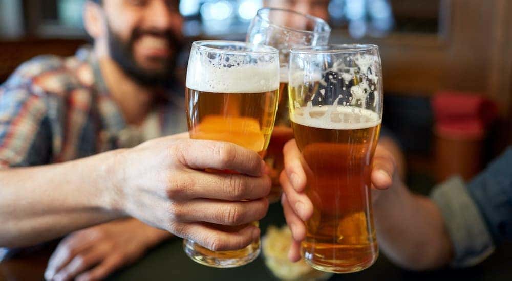 A group of men are toasting beers at a brewery in Wilmington, OH.