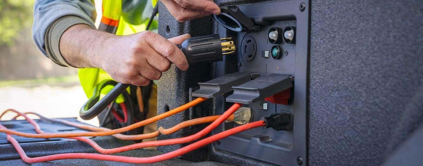 A close up is shown of the tailgate power station on a 2021 Ford F-150 Hybrid.