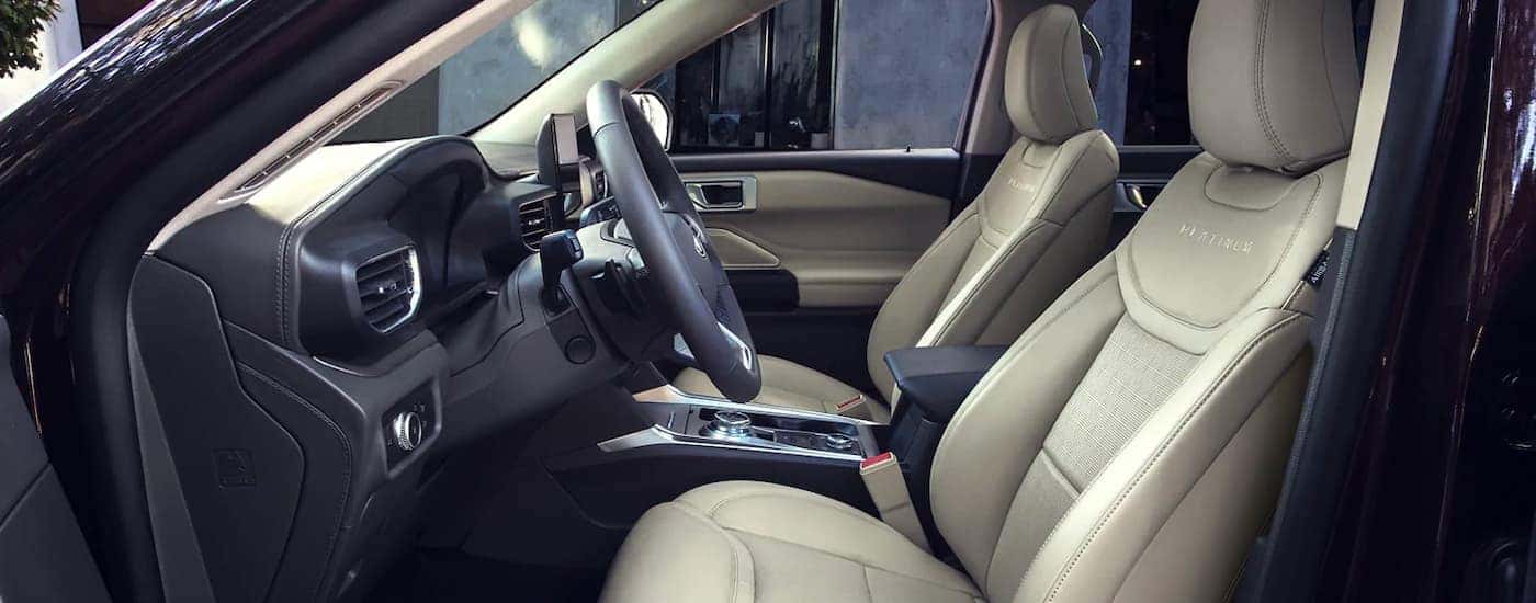 The gray and black interior is shown from the drivers side on a 2021 Ford Explorer.