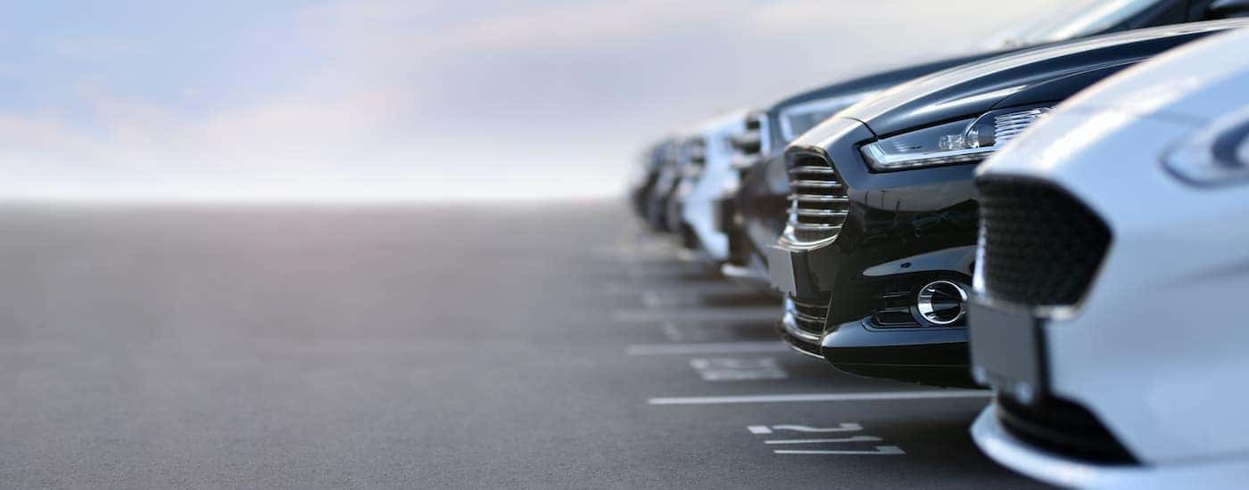 A row of cars are shown from a low angle.