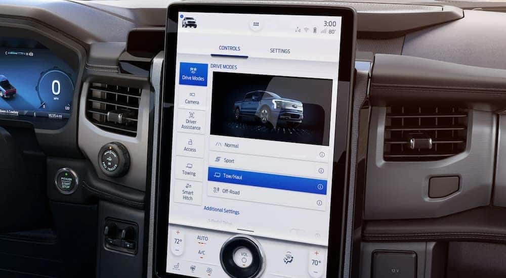The interior of a 2022 Ford Lightning shows the infotainment screen.