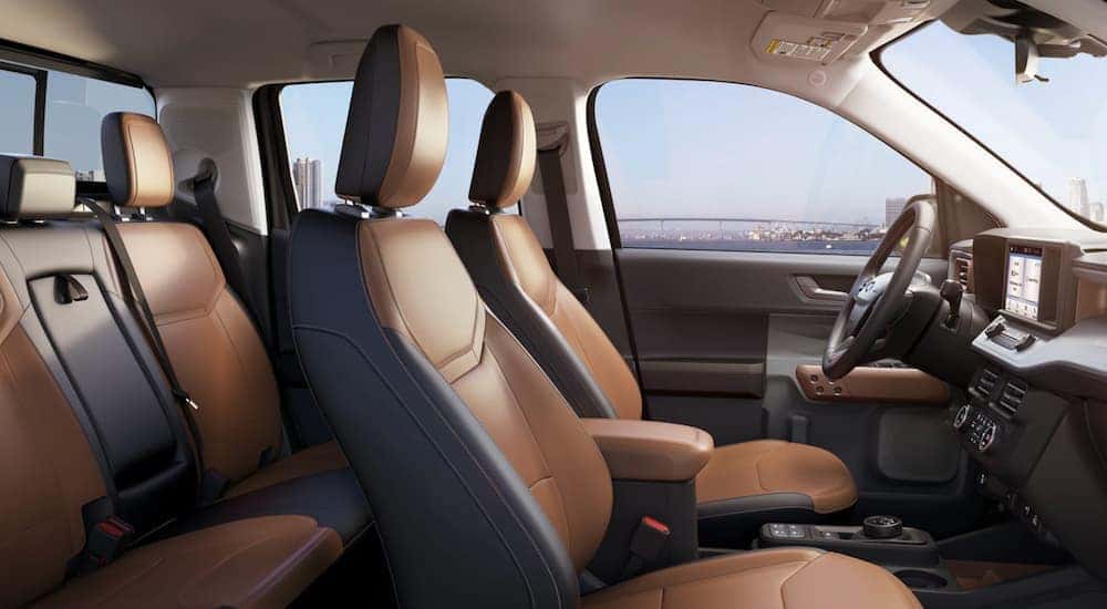 The interior of a 2022 Ford Maverick shows two rows of seating.