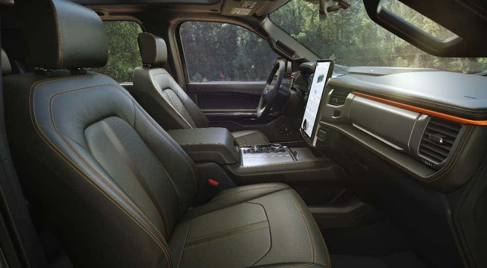 The black and orange accented interior of a 2022 Ford Expedition Timberline is shown at Cincinnati car dealers.