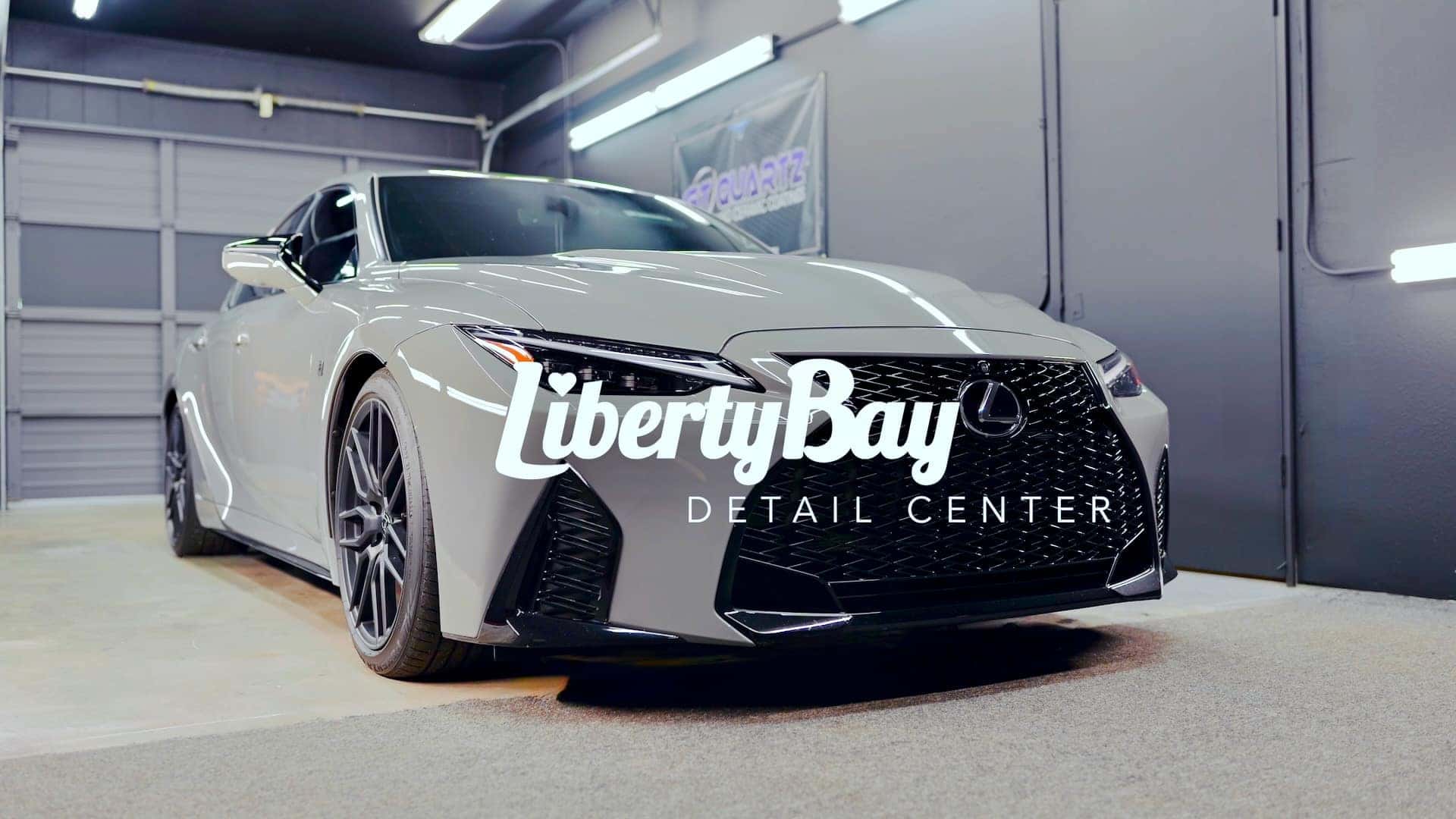 Freshly detailed gray Lexus IS outside the Liberty Bay Auto detail bay