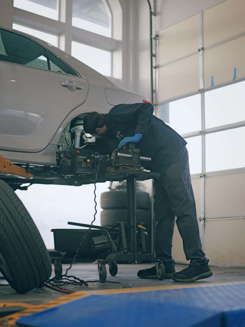 Liberty Bay Auto technician diagnosing a vehicle in the Poulsbo service bay
