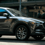 Mazda CX-5 driving in busy urban area