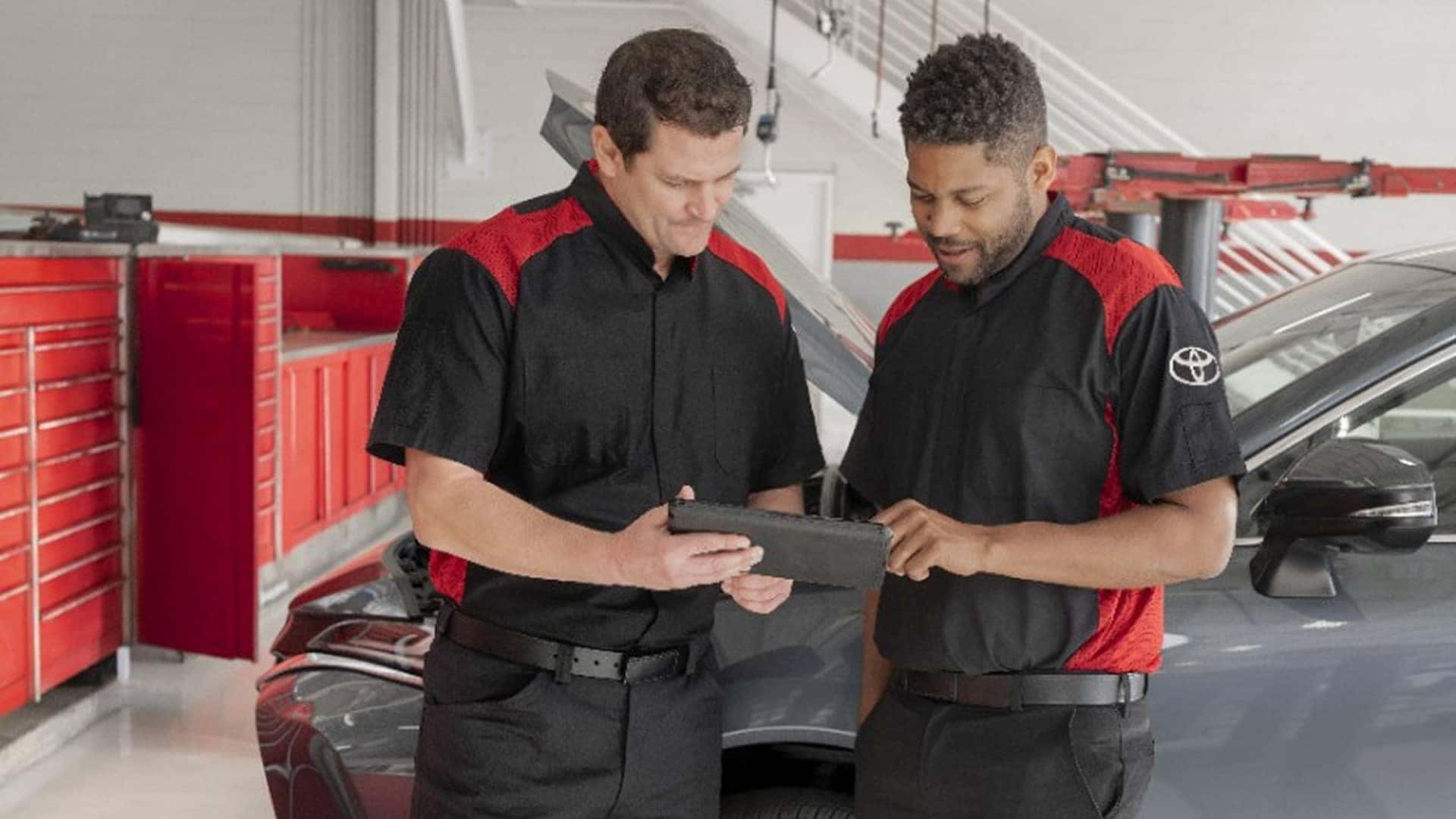 service tech assisting another service tech