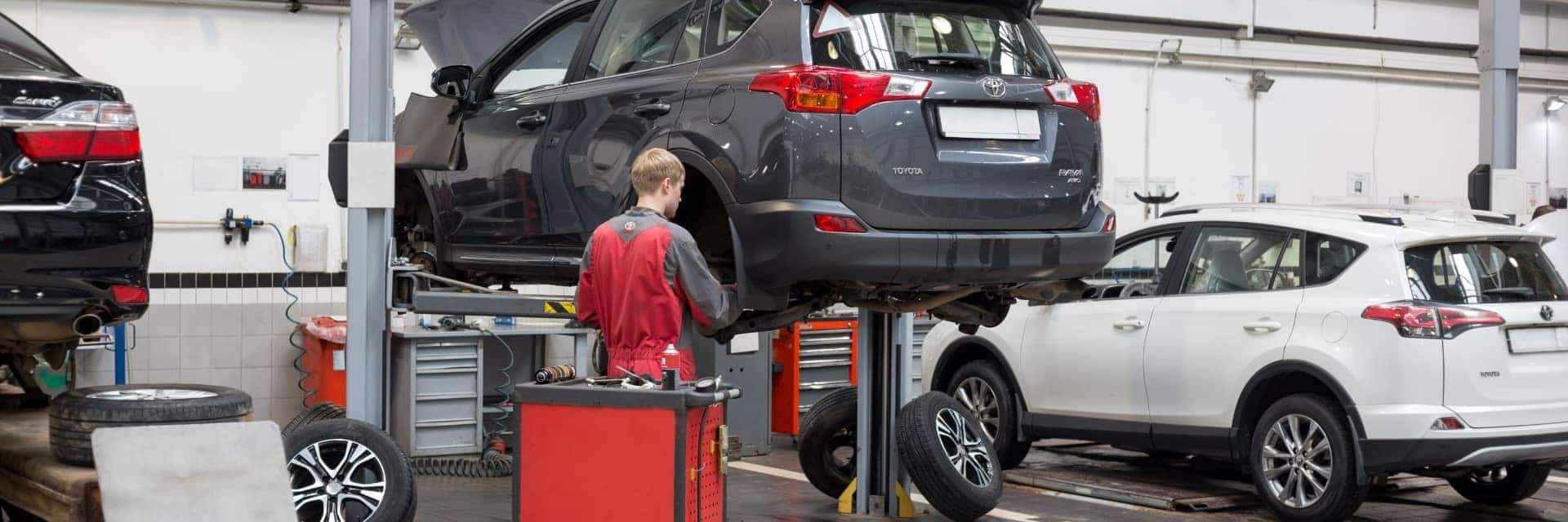 toyota service tech working on vehicles