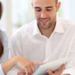 couple looking at touchpad