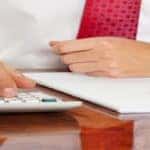 Man with pen and calculator