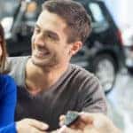 young couple getting keys
