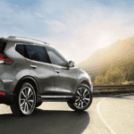 2019 silver nissan rogue on country road