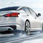 nissan altima driving on snowy highway