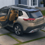 Silver Nissan Rogue in Driveway with Family