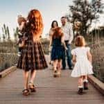 A family on a wooden bridge