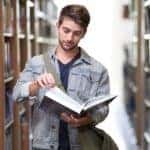 college student reading a book