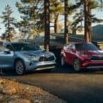 2020 Toyota Highlander models parked in front of a home
