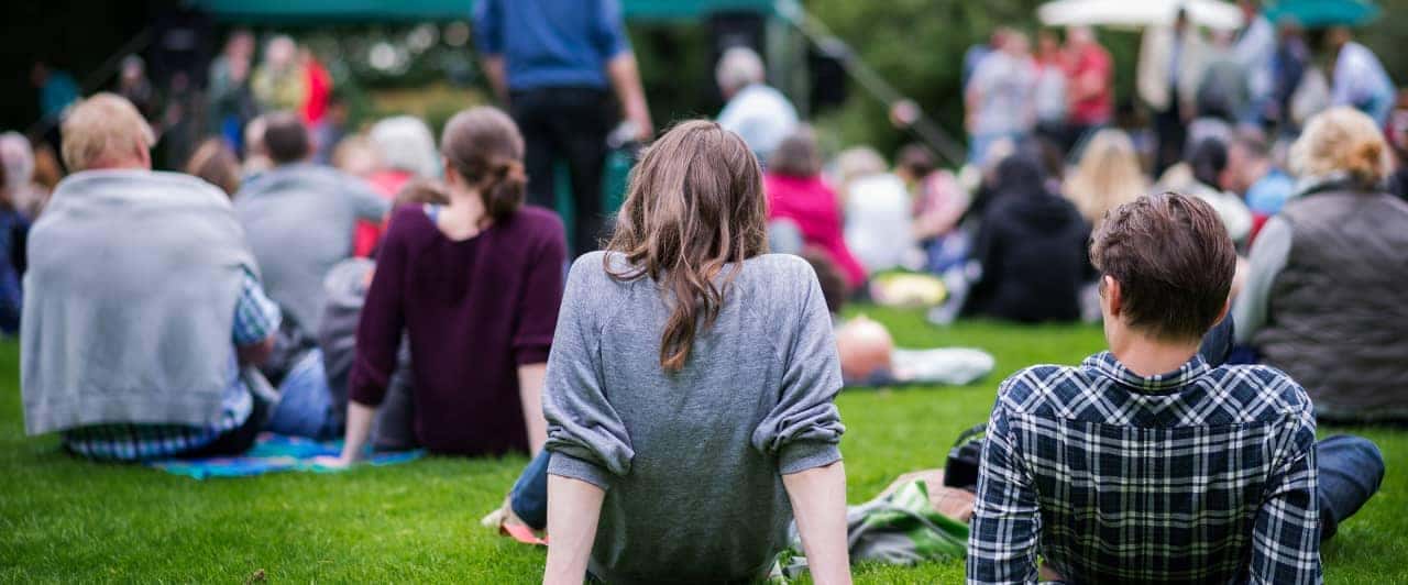 friends in grass at event