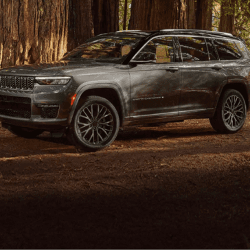 2022 Jeep Grand Cherokee L Parked Near Beautiful Woods