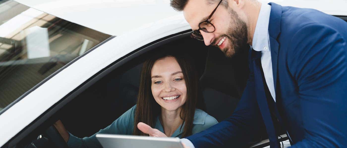 Customer looking over details with salesman