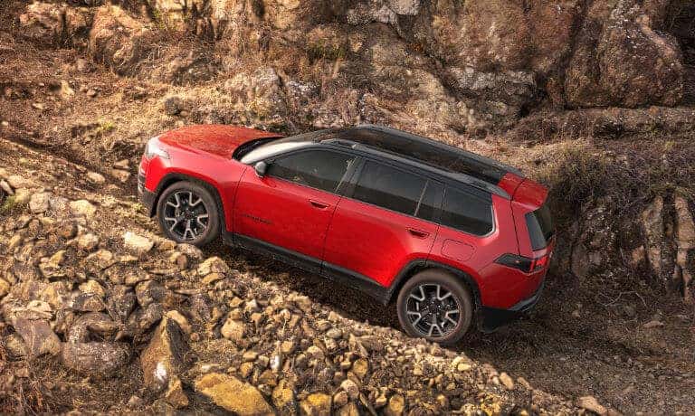 2026 Jeep Cherokee Exterior Driving Up Rocky Incline
