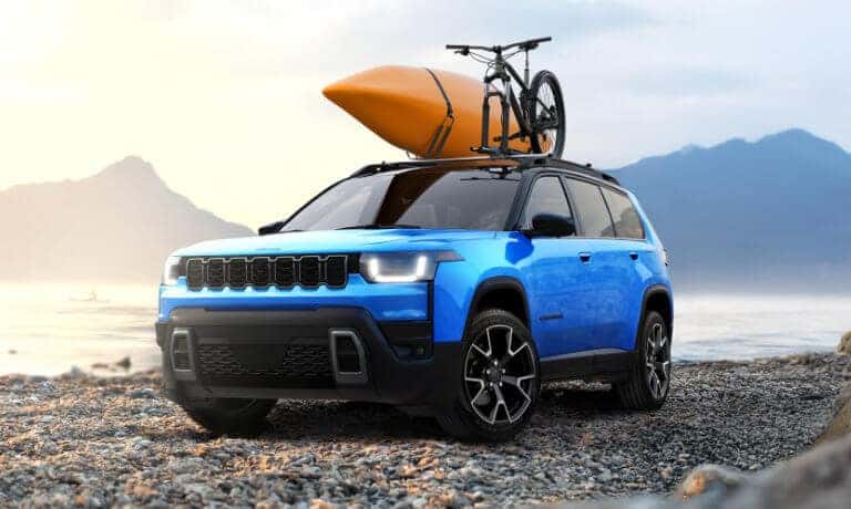2026 Jeep Cherokee Exterior On Rocky Beach With Kayak