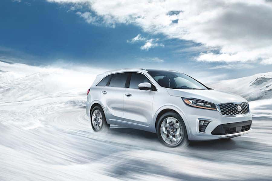 2019 Snow White Pearl Kia Sorento driving in snow