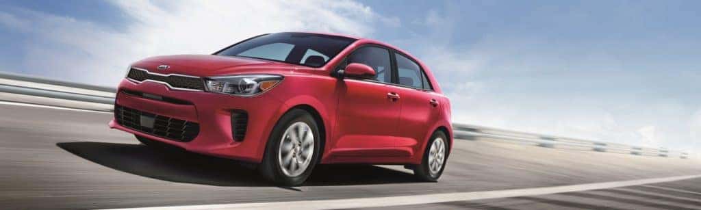 2020 Kia Rio red driving on highway