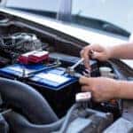 Mechanic installing battery