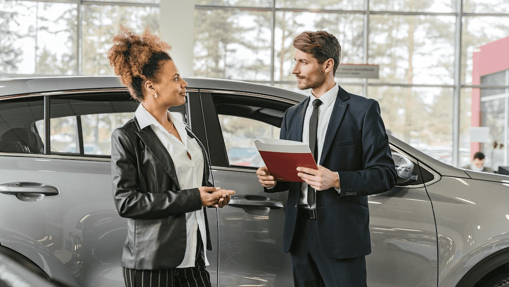 Sales Advocate and customer discussing the car shopping process