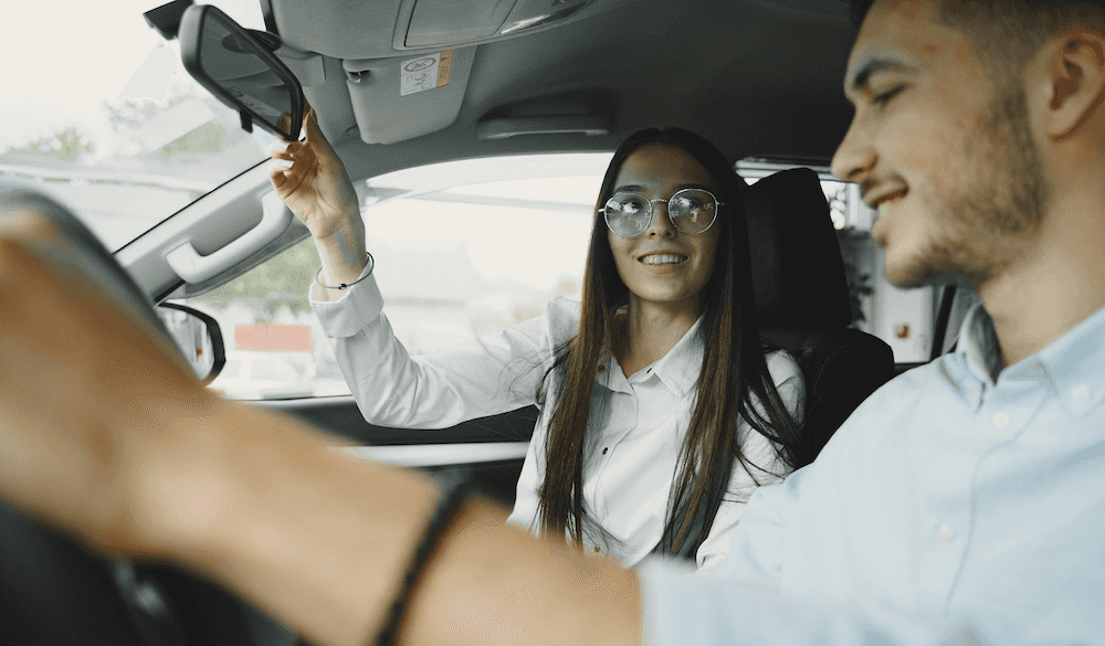 Sales Advocate and customer taking a car for a test drive