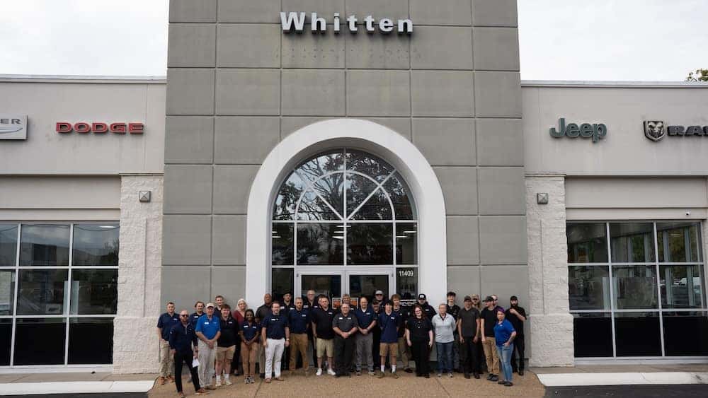 Whitten Brothers CDJR of Ashland team in front of the car dealership