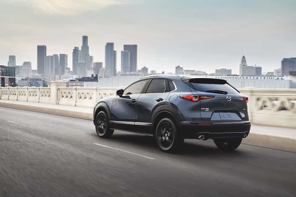 Mazda CX-30 driving down a road