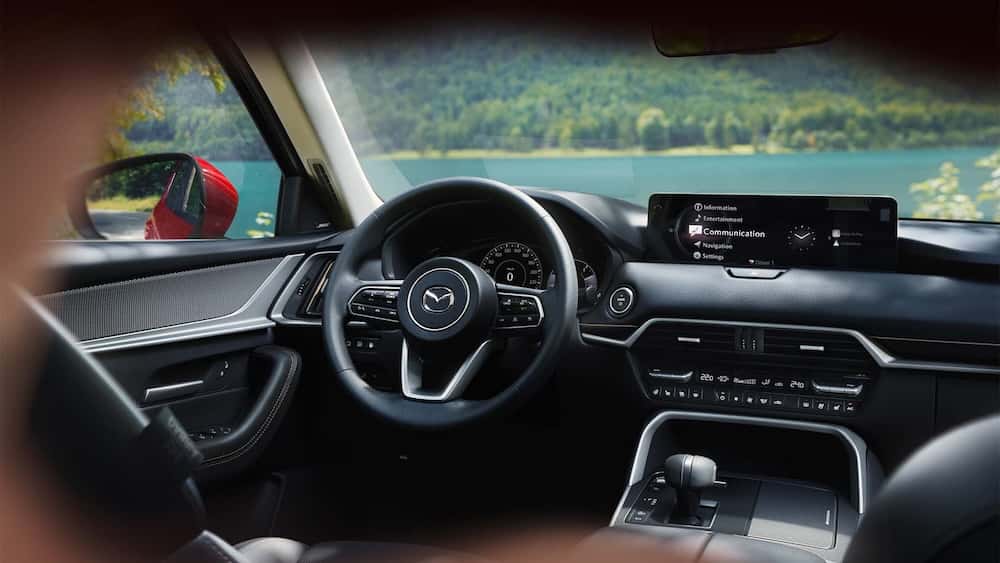 Mazda SUV interior steering wheel and touchscreen