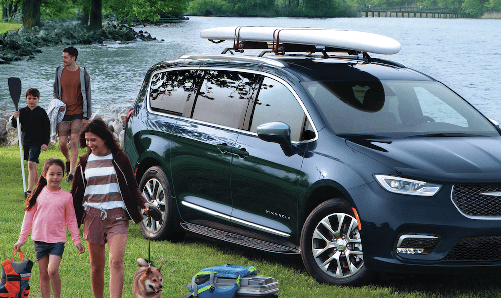 Family enjoying the day with their Chrysler Pacifica hybrid minivan