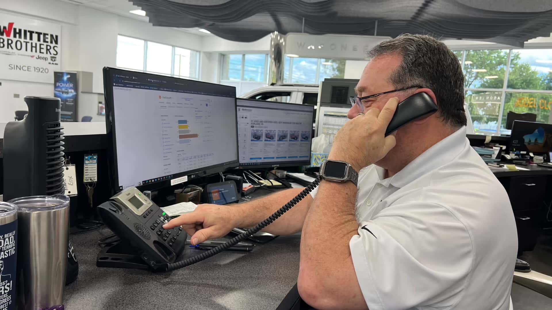 Mazda sales advocate speaking to a customer about a Mazda PHEV SUV