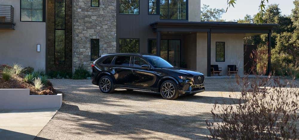 2026 Mazda CX-70 parked outside of a house