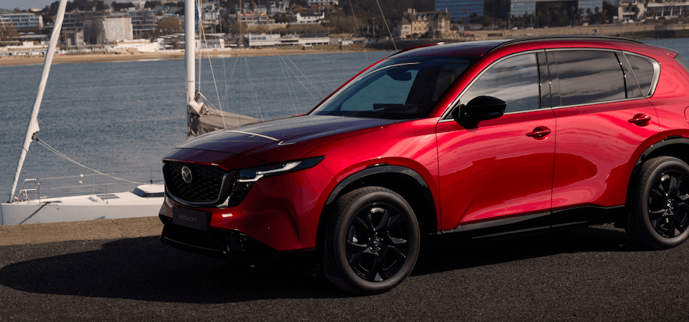 Red 2026 Mazda CX-5 parked near water